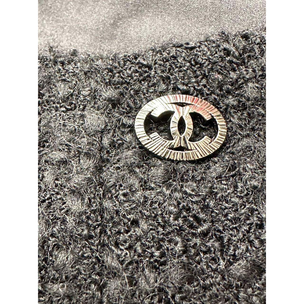 CHANEL Black Bouclé Wool A-Line Skirt with CC Button - FR 48 Pre-owned