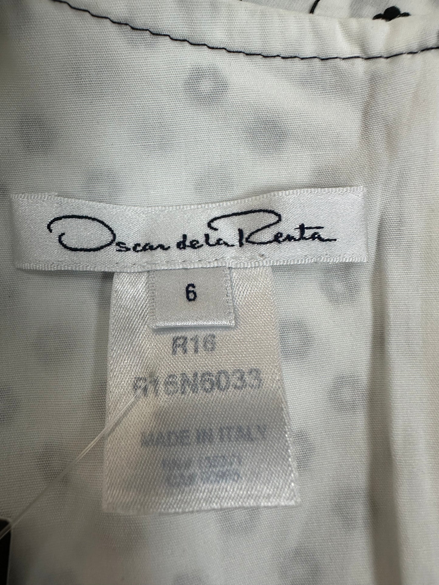 Polka dot dress with asymmetric hem