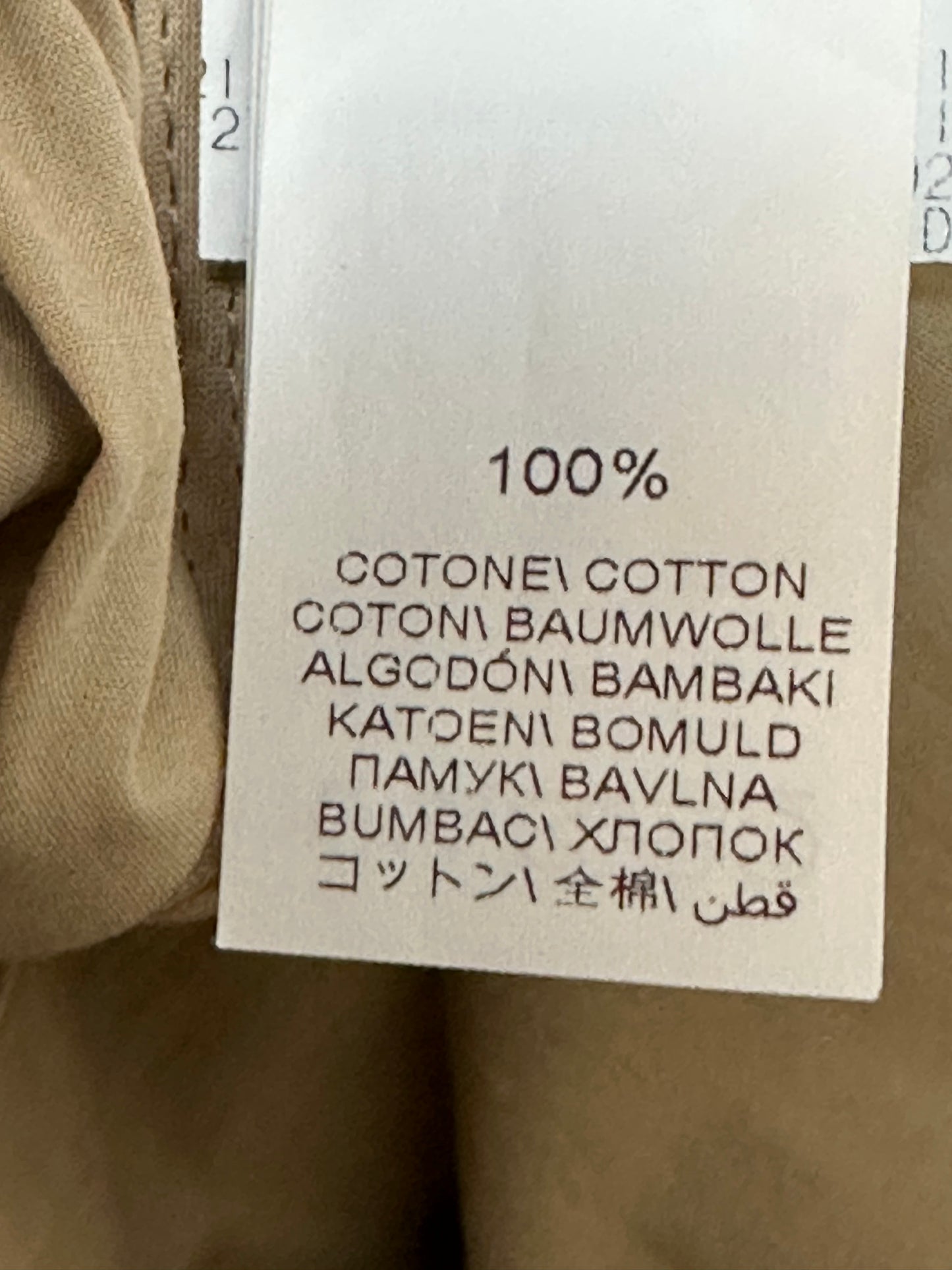 Loose fit cotton trousers in a versatile sand colour