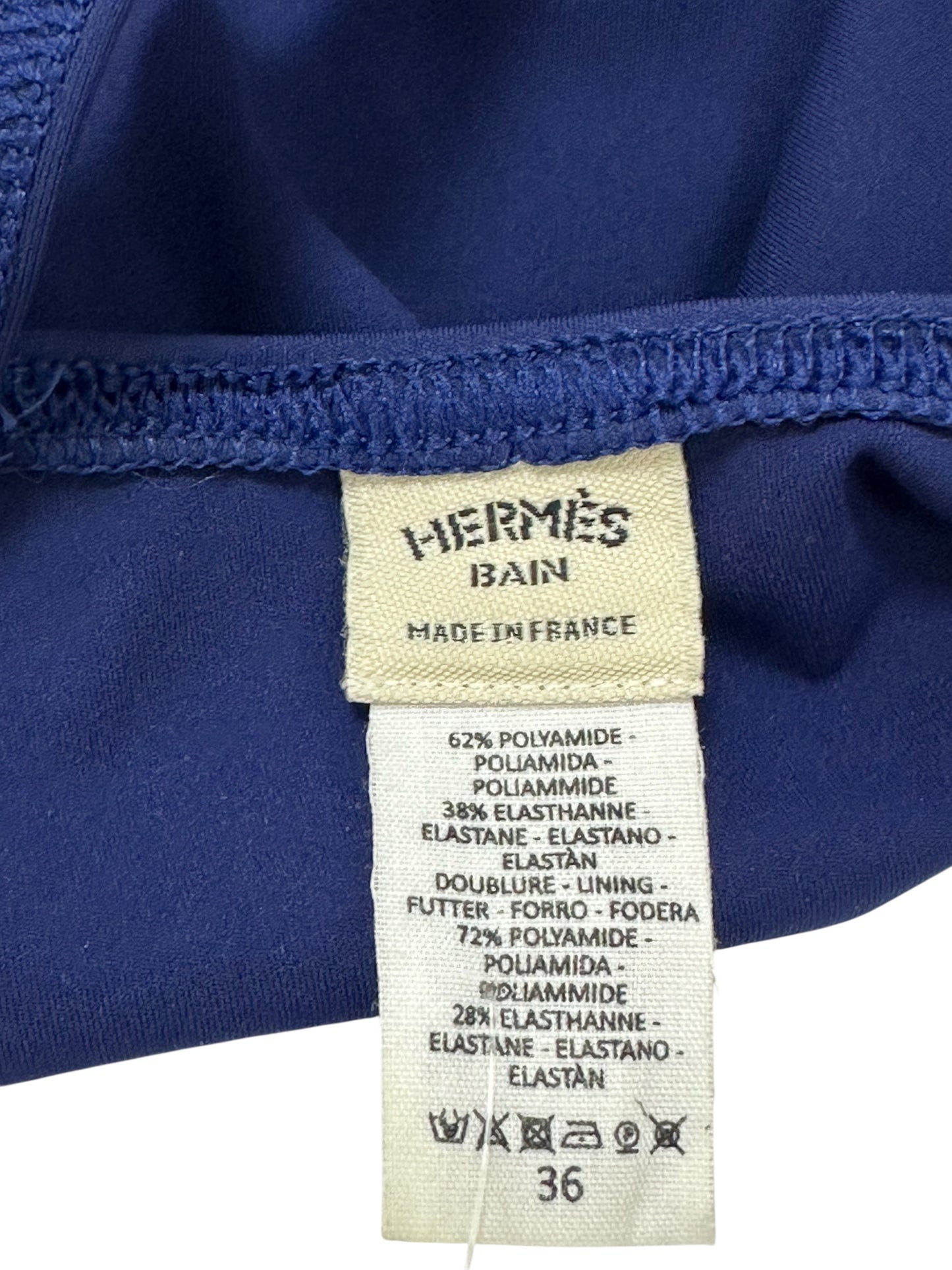 One-piece blue swimsuit with decorative buckle