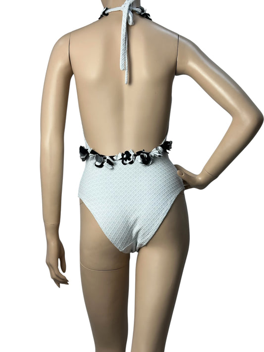 White swimsuit with neckline embellishment