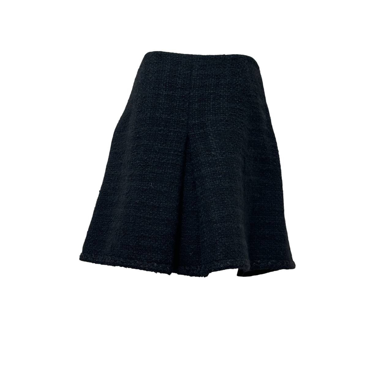 CHANEL Black Bouclé Wool A-Line Skirt with CC Button - FR 48 Pre-owned