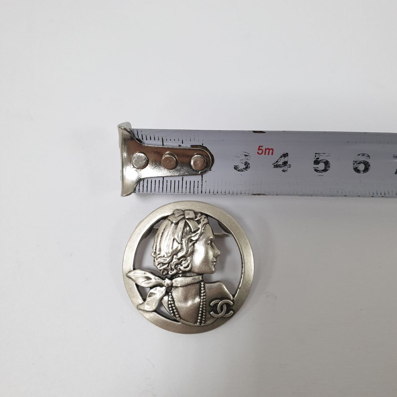 Chanel Silver-tone Mademoiselle Brooch Pre-owned