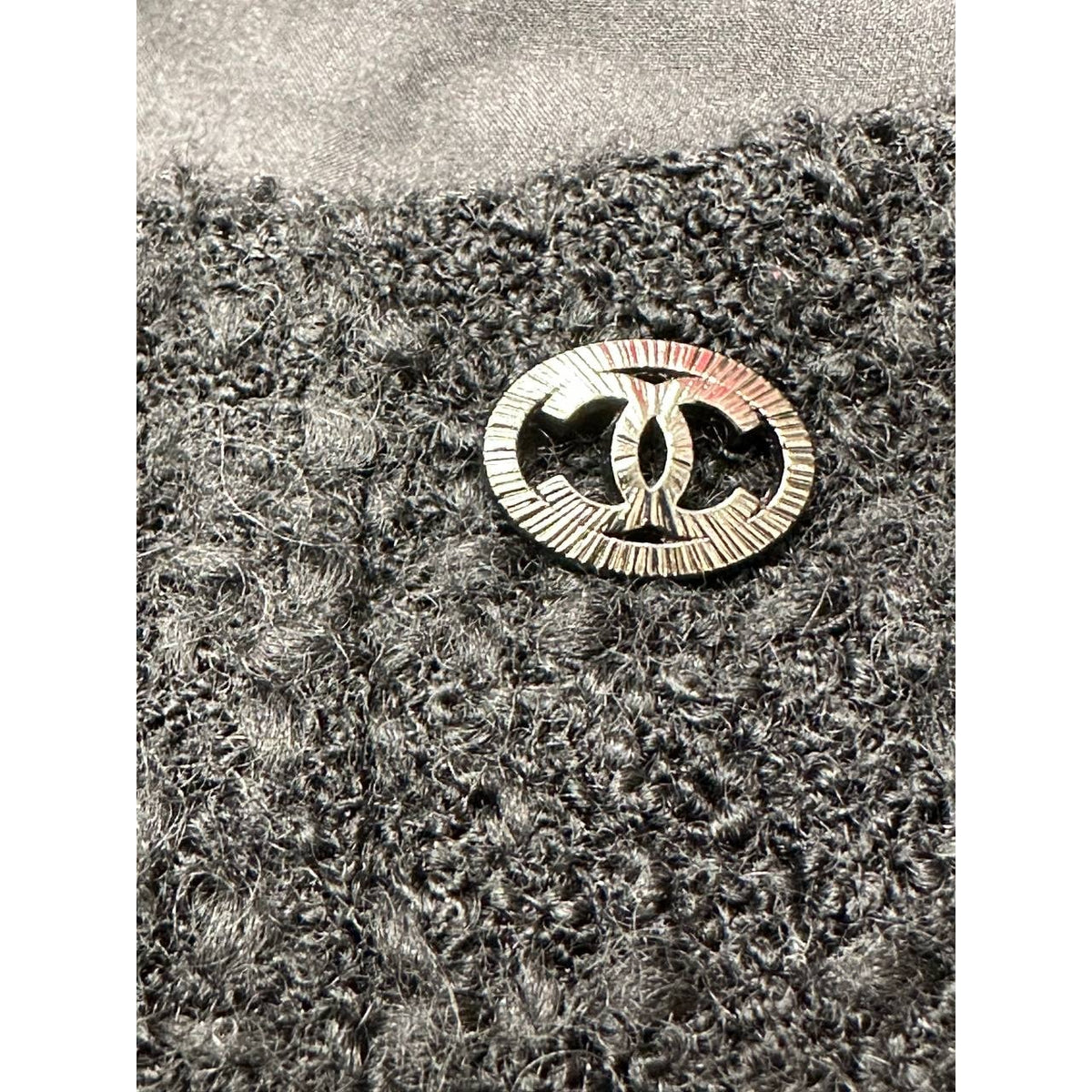 CHANEL Black Bouclé Wool A-Line Skirt with CC Button - FR 48 Pre-owned