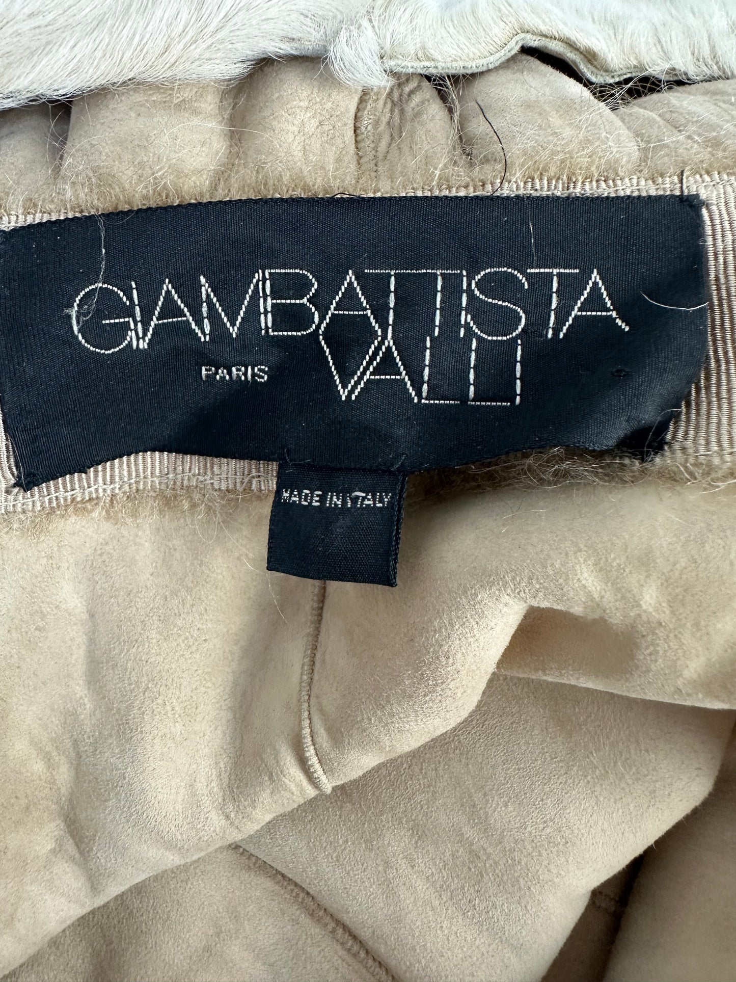 Astrakhan lamb coat with ruffles