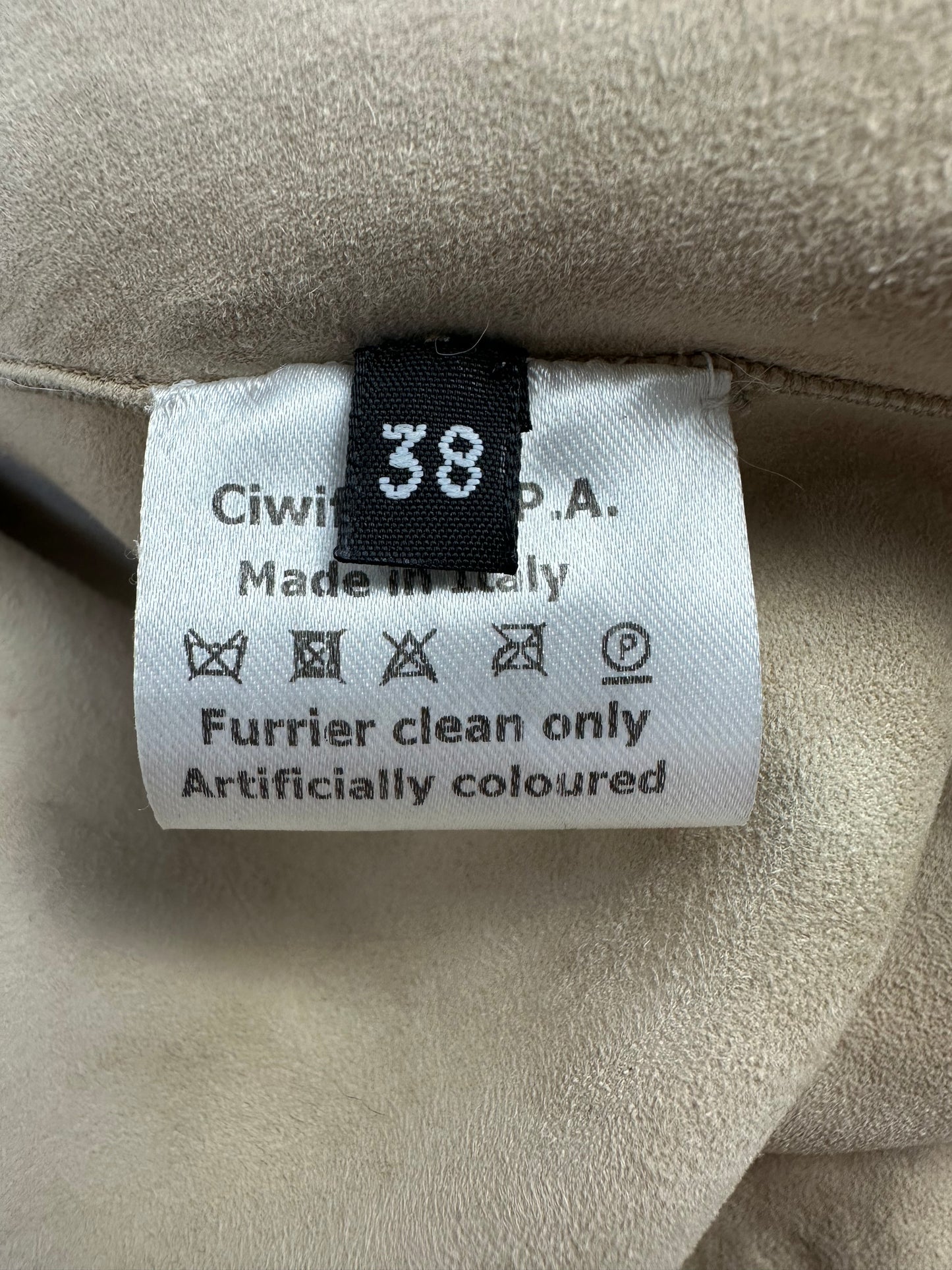 Astrakhan lamb coat with ruffles