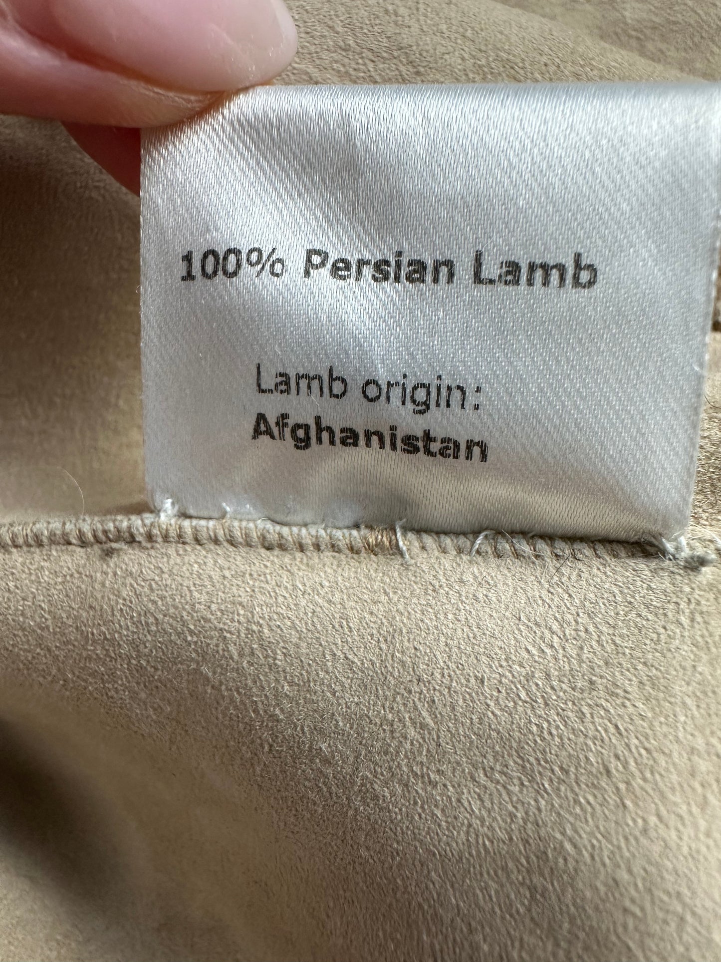 Astrakhan lamb coat with ruffles