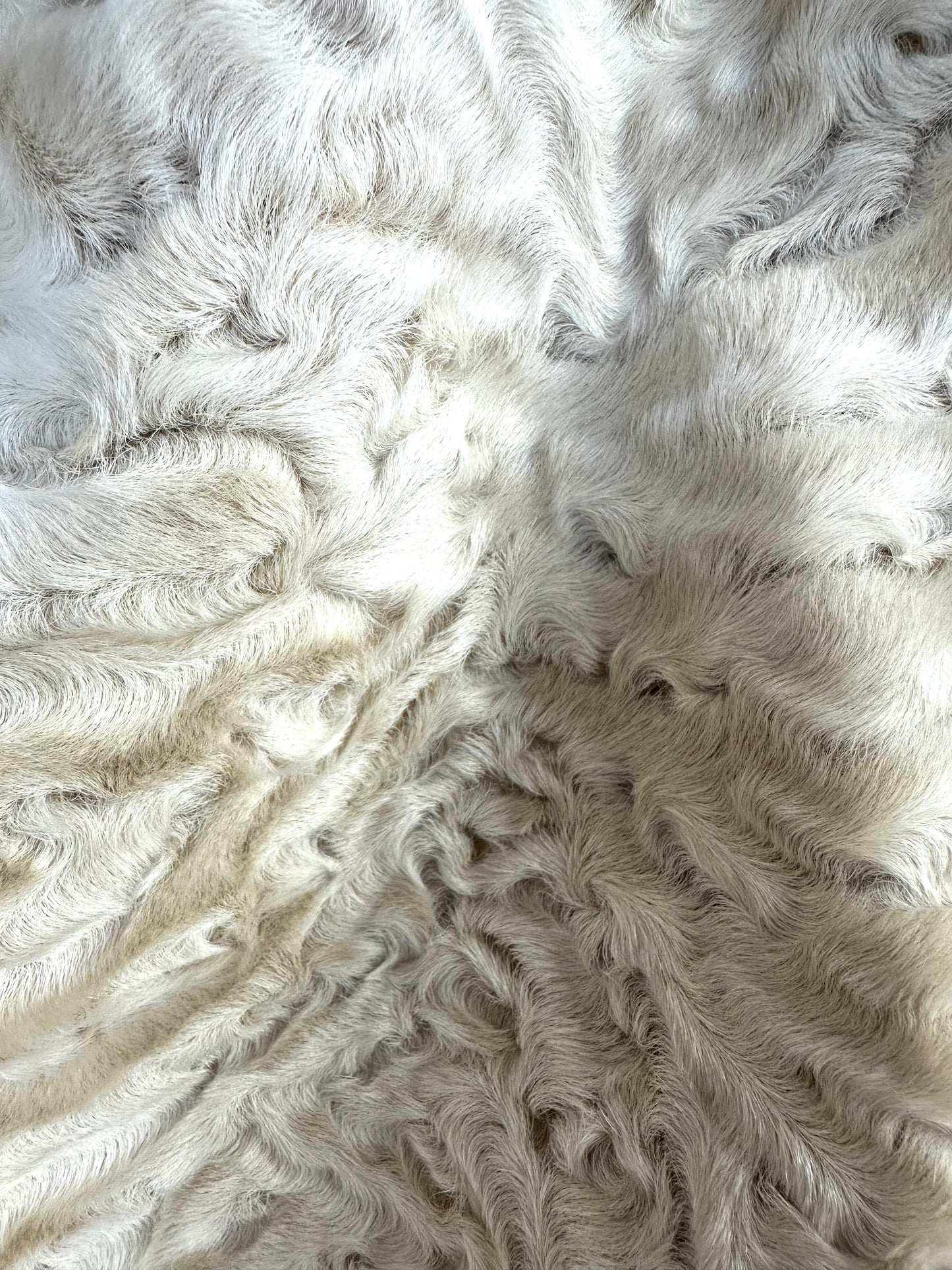 Astrakhan lamb coat with ruffles