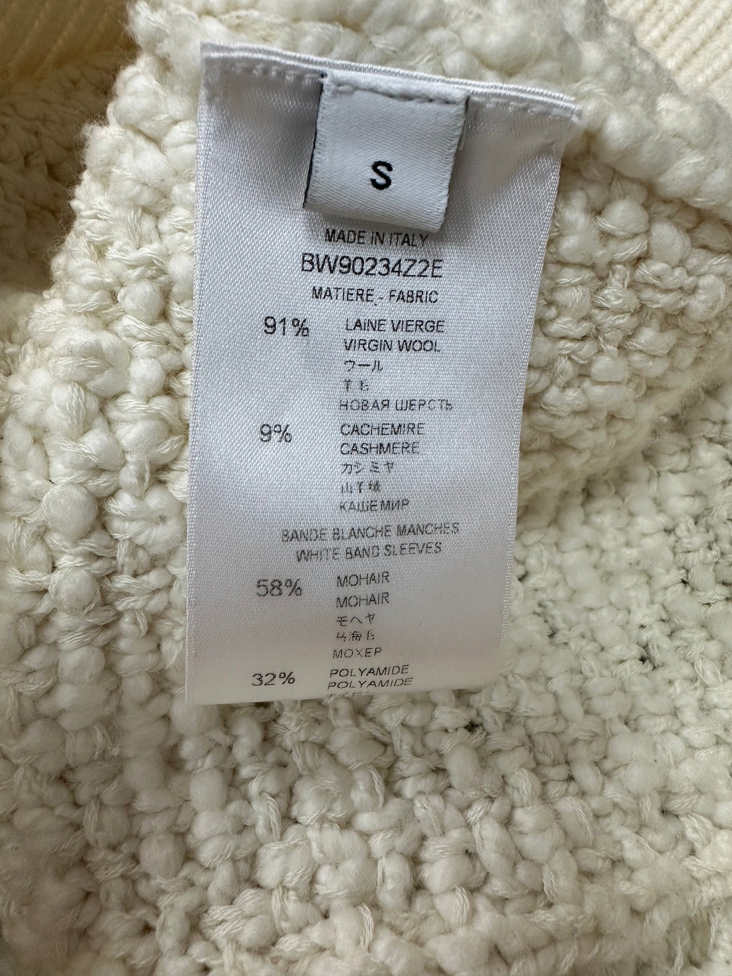 White knitted sweater with textured pattern