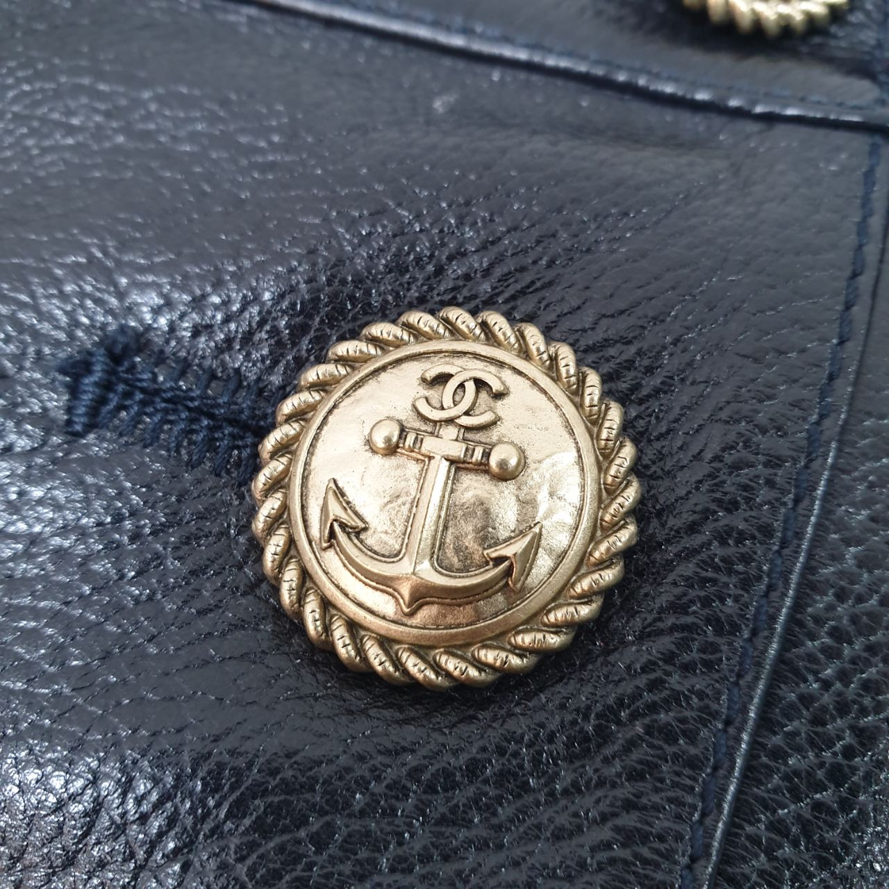 Leather skirt with decorative buttons