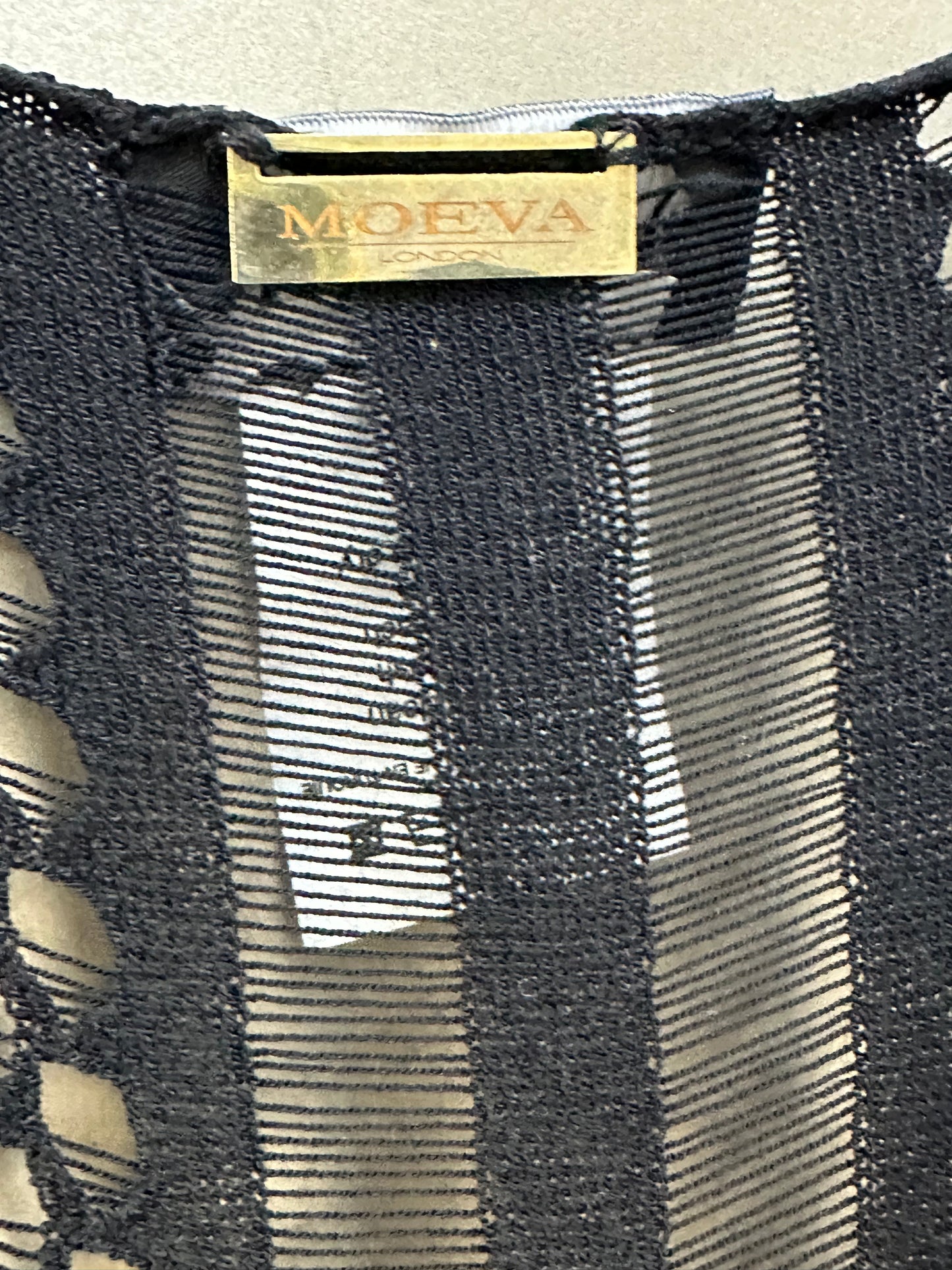 Dress with lace-knit design and sheer inserts