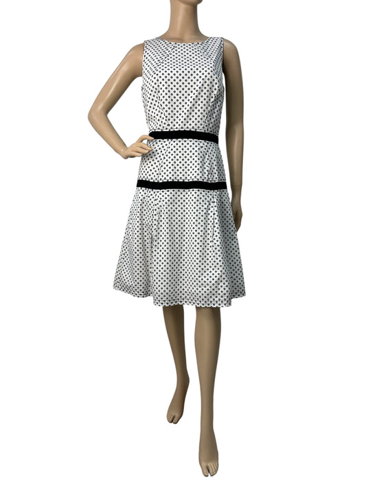 Polka dot dress with asymmetric hem