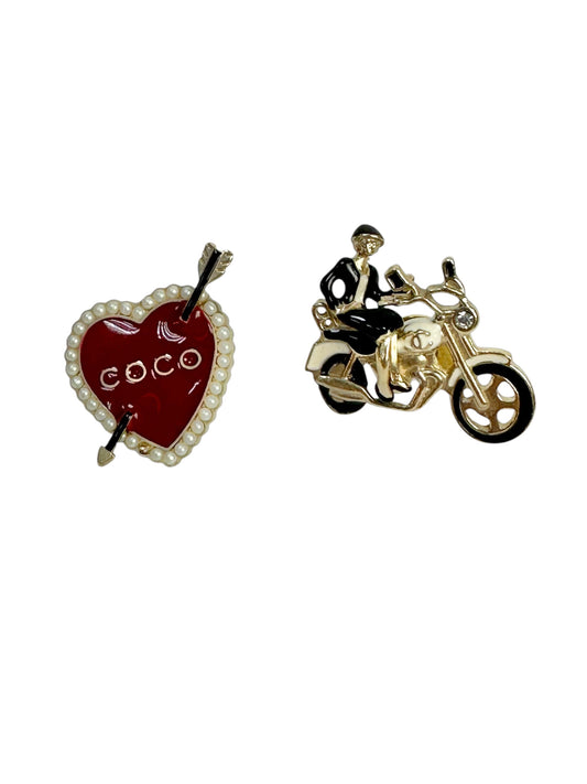 Set of enamel metal brooches
