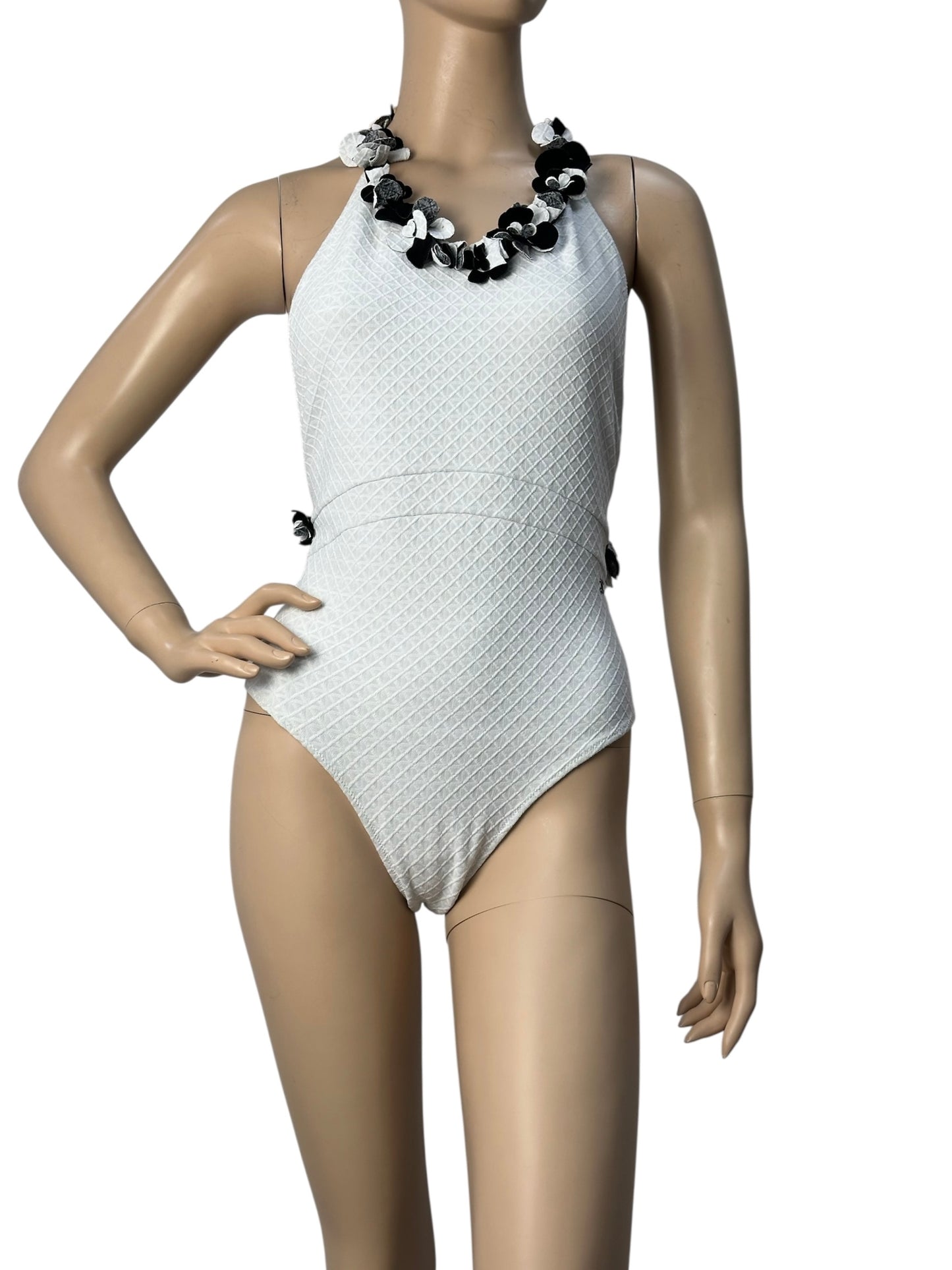 White swimsuit with neckline embellishment
