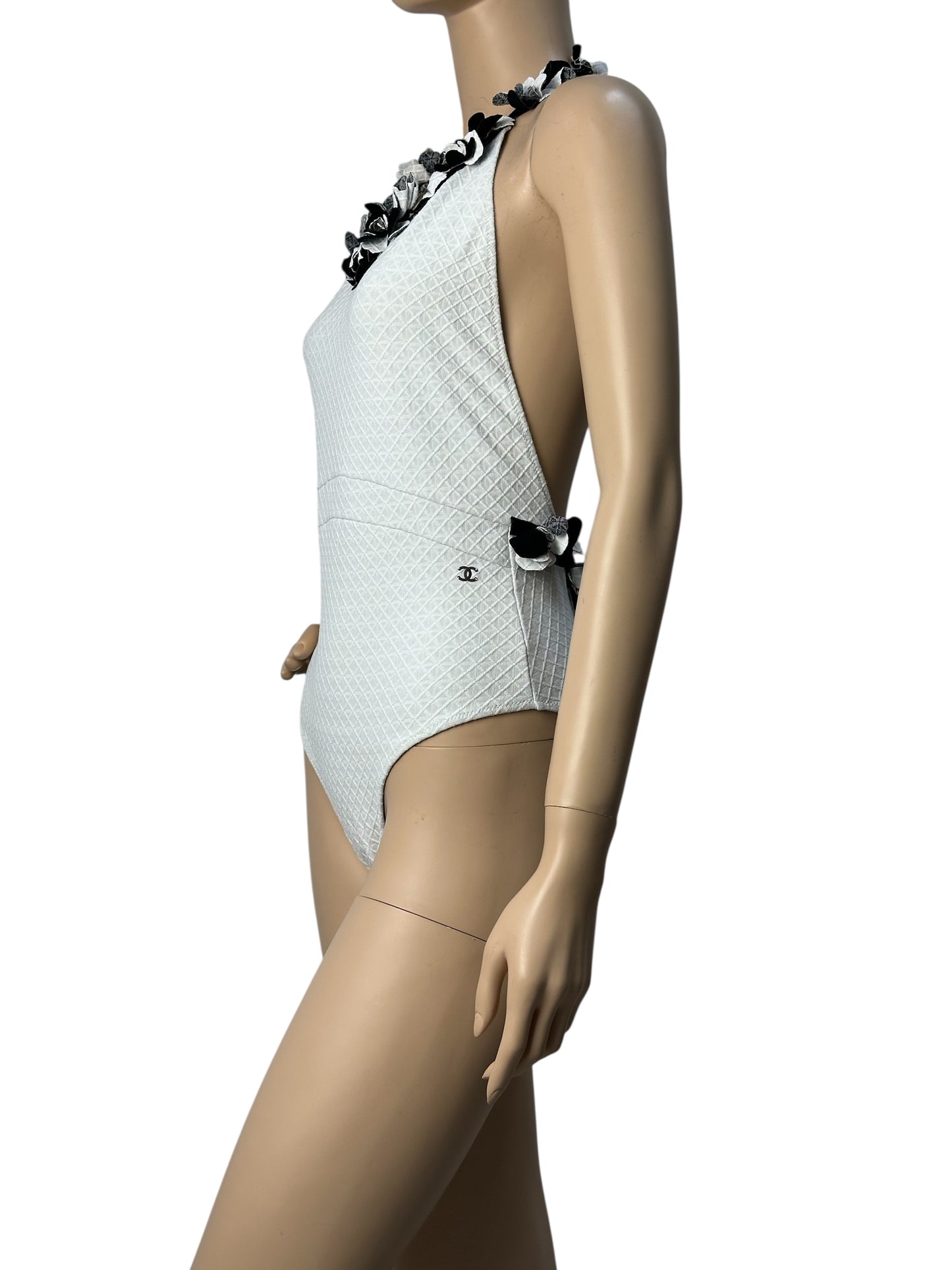 White swimsuit with neckline embellishment