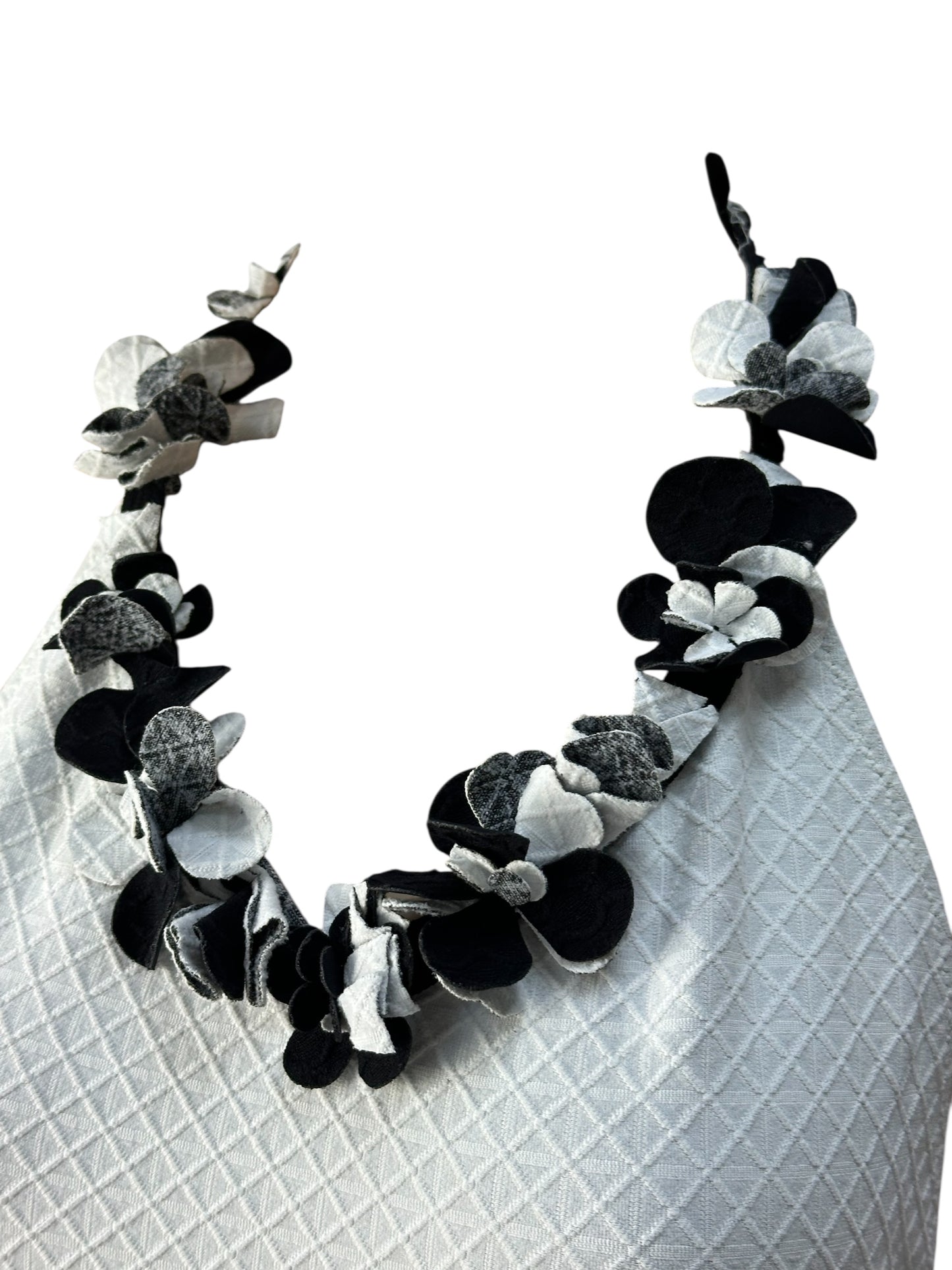 White swimsuit with neckline embellishment