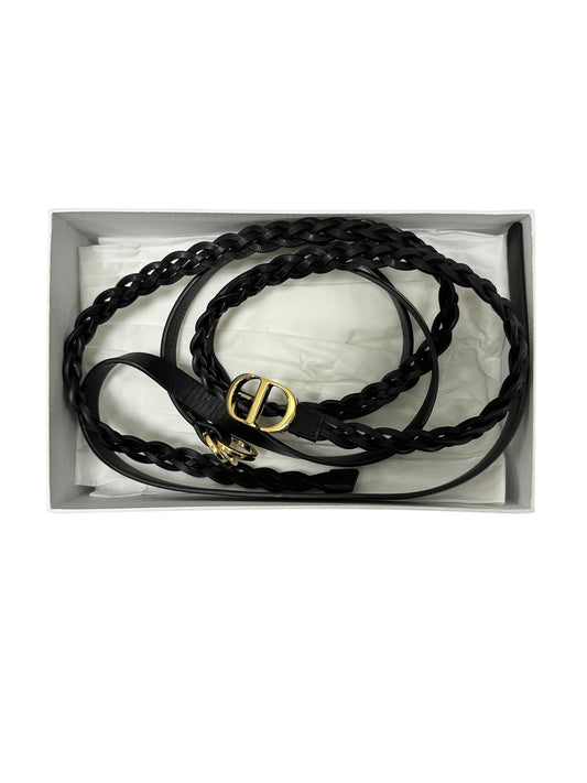 Leather belt with braided design and gold buckle