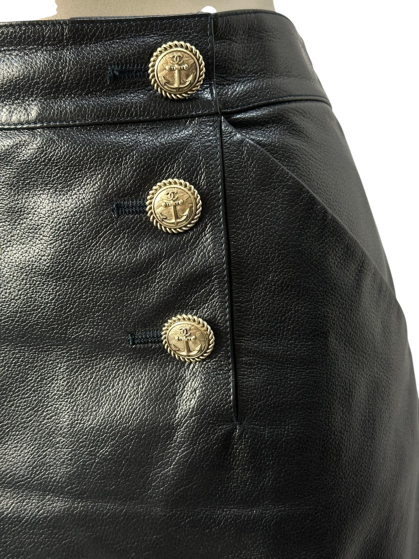 Leather skirt with decorative buttons