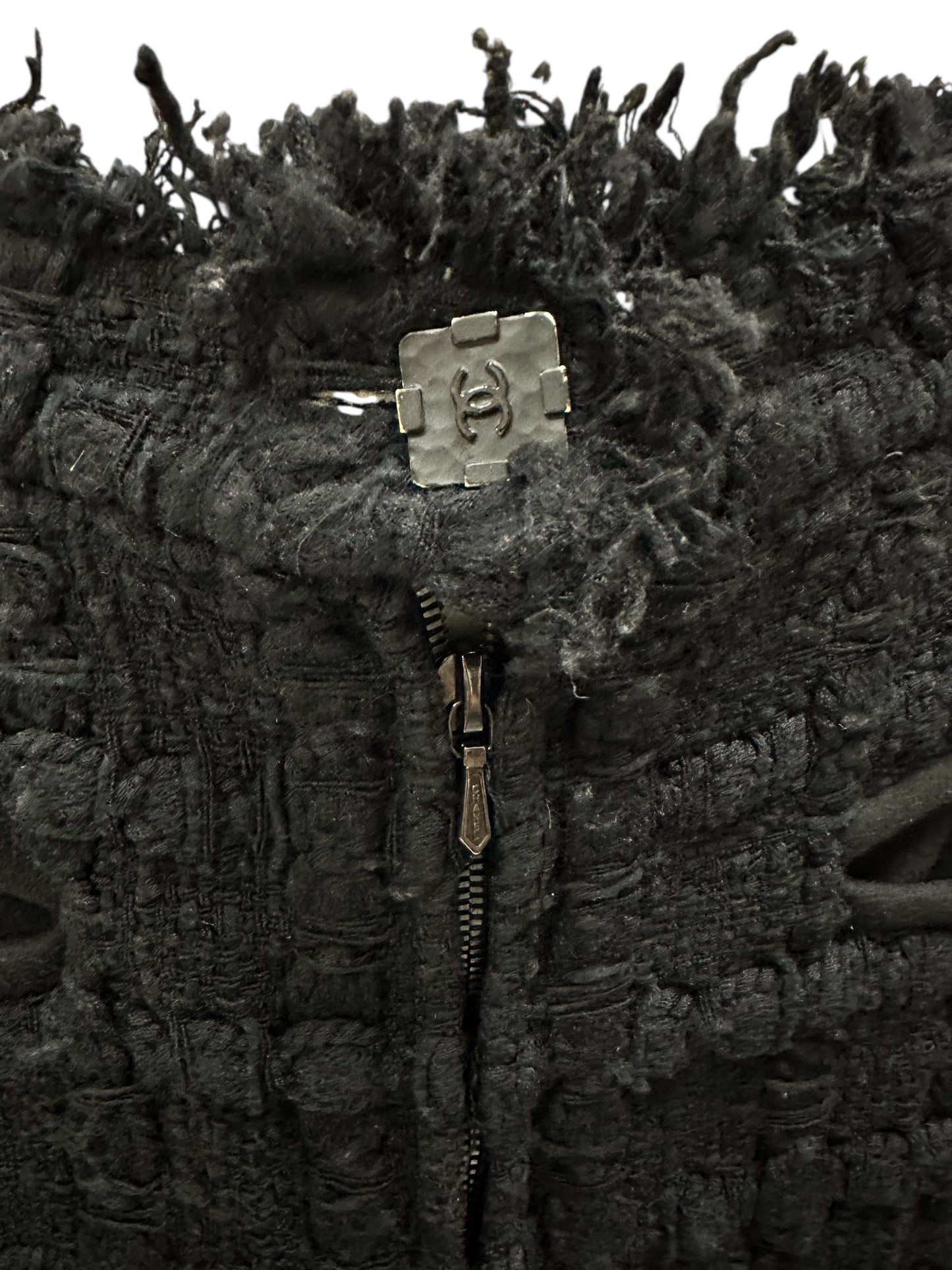 Tweed skirt with fringe and decorative hardware